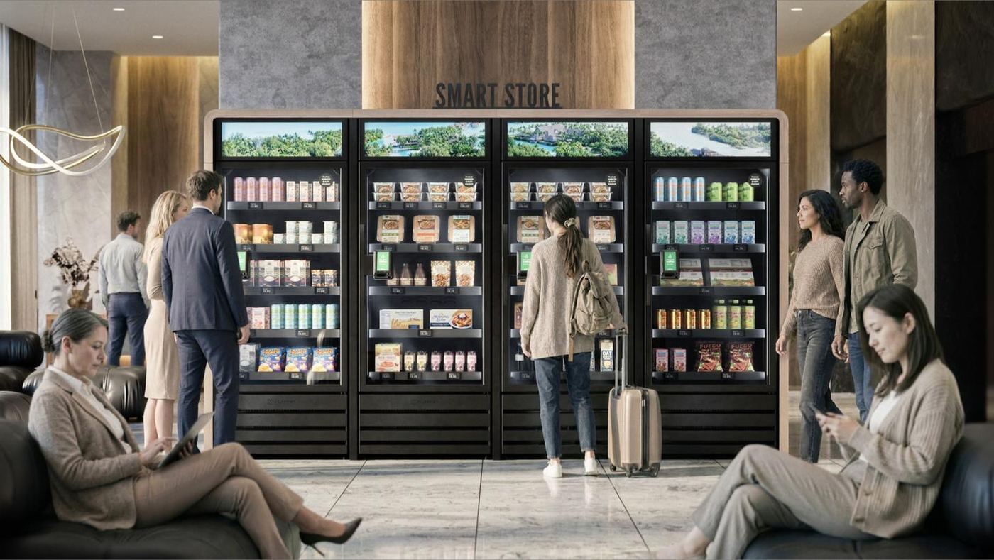 A four-door Skala smart store in a hotel lobby, guests browsing.